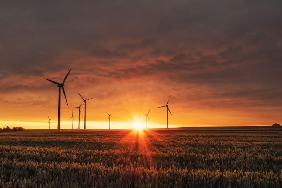 Wind turbines silhouetted at sunset